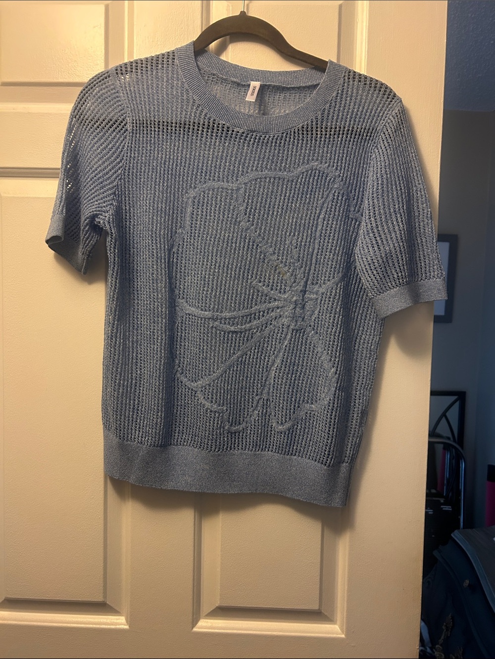 Lite blue open woven top.  Very breathable, floral embossed.